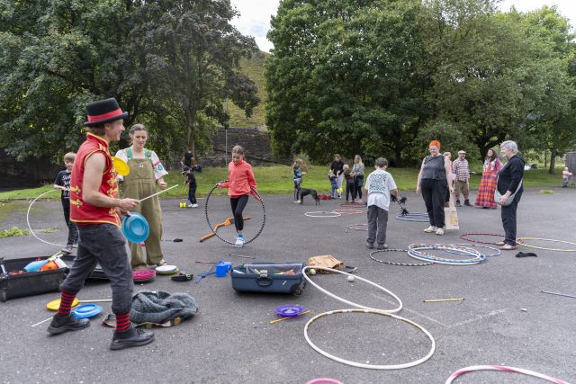 People participating in a circus skills workshop