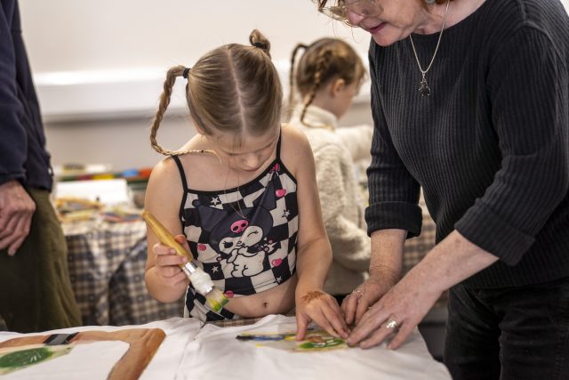 Child participating in t shirt printing