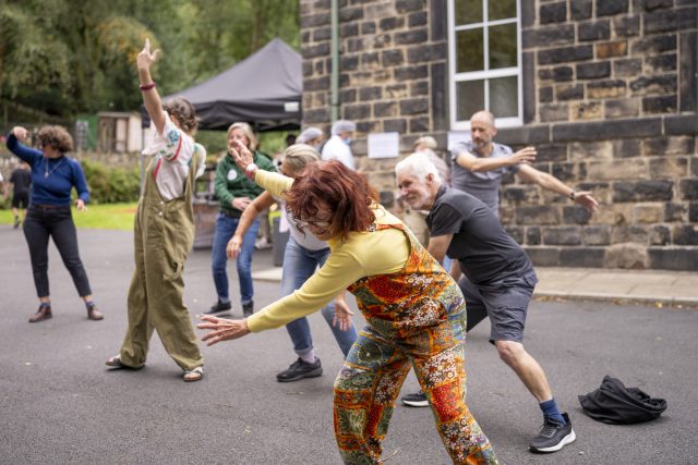 Adults participating in a dance workshop