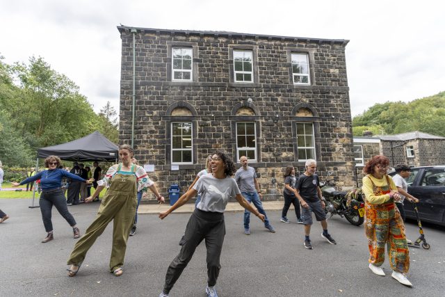 Adults participating in a dance workshop