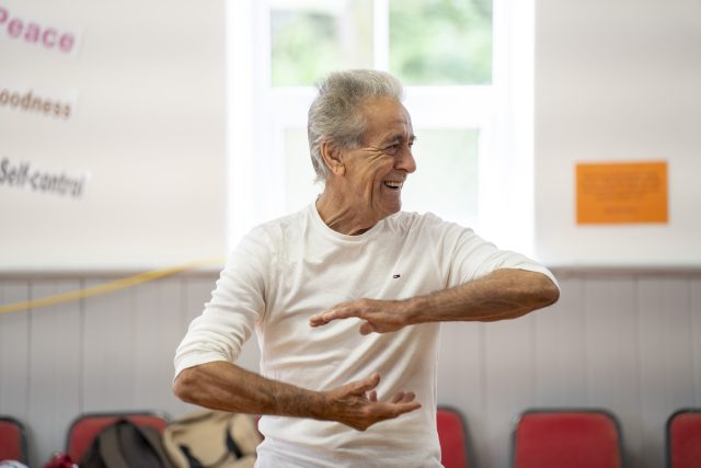 Man facilitating Tai Chi class