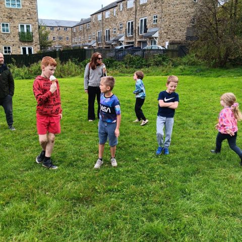 Children on playing field talking