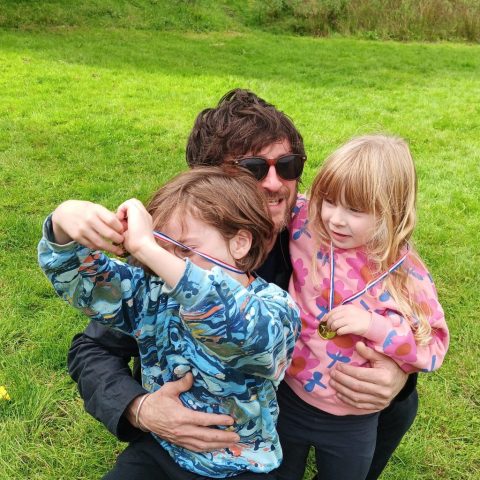 Picture of family with winning medals