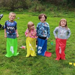 Children in sack race - sports day games