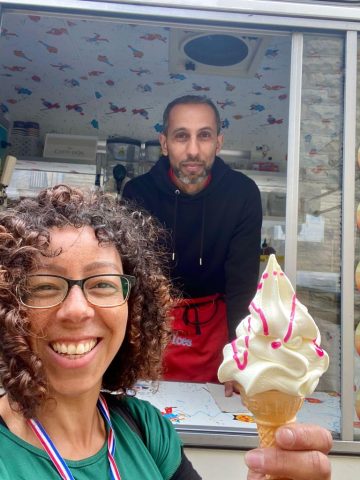 Picture of person holding an ice cream and server